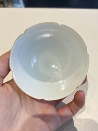 A pair of Chinese qingbai vases and a cup on a stand, 20th C.