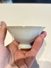 A pair of Chinese qingbai vases and a cup on a stand, 20th C.