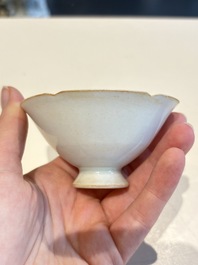 A pair of Chinese qingbai vases and a cup on a stand, 20th C.