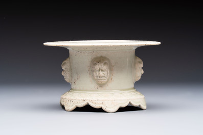 A Chinese qingbai censer with masks in relief, 20th C