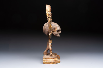 An Italian 'Memento Mori' wooden funerary palm holder with a plaster skull, 19th C.
