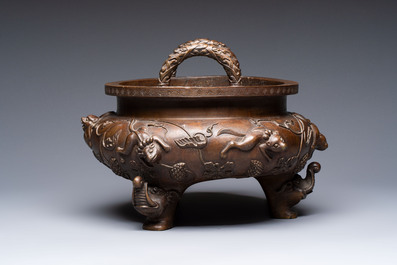 A rare Chinese bronze tripod censer with relief mythical animal and grape design, Xuande mark, 19th C.