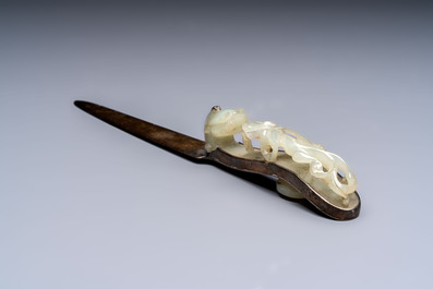 A Chinese mounted magnifying glass with a jade handle and a sterling silver letter opener with a jade handle, 19th C.