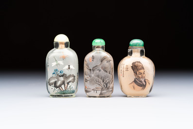 A Chinese rock crystal and two glass inside painted snuff bottles, 19/20th C., with a signed copy of 'Chinese Inside Painting of the Modern Age', 2005