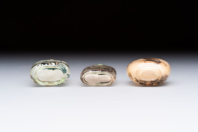 A Chinese rock crystal and two glass inside painted snuff bottles, 19/20th C., with a signed copy of 'Chinese Inside Painting of the Modern Age', 2005
