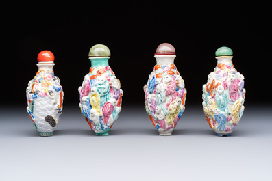 Four Chinese famille rose moulded 'Luohan' snuff bottles, Qianlong marks, 19th C.