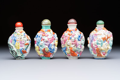 Four Chinese famille rose moulded 'Luohan' snuff bottles, Qianlong marks, 19th C.