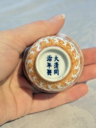 A Chinese iron-red decorated blue and white 'Dragon' saucer and a cup, Yongzheng and Tongzhi mark, 19/20th C.