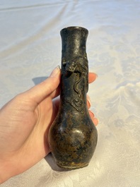 A small Chinese bronze vase with a chilong on a wooden stand, Yuan