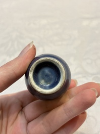 A pair of Chinese blue-glazed 'Hatcher Cargo' vases with incised dragons and a stem cup, Transitional period