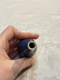 A pair of Chinese blue-glazed 'Hatcher Cargo' vases with incised dragons and a stem cup, Transitional period