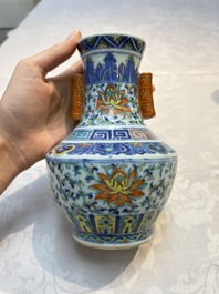 A pair of Chinese doucai 'Hu' vases with lotus scroll design, Qianlong mark, 19th C.