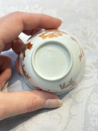 Three fine Chinese eggshell iron-red and gilt-decorated 'Boy and Goats' cups and saucers, Yongzheng