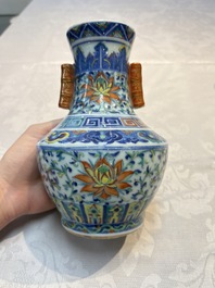 A pair of Chinese doucai 'Hu' vases with lotus scroll design, Qianlong mark, 19th C.