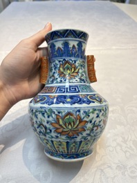 A pair of Chinese doucai 'Hu' vases with lotus scroll design, Qianlong mark, 19th C.