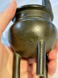 A Chinese silver-inlaid bronze tripod censer with clouds design, 19th C.