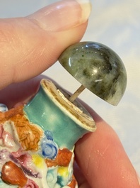 Four Chinese famille rose moulded 'Luohan' snuff bottles, Qianlong marks, 19th C.