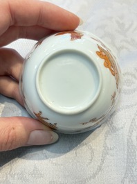 Three fine Chinese eggshell iron-red and gilt-decorated 'Boy and Goats' cups and saucers, Yongzheng