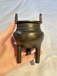 A Chinese silver-inlaid bronze tripod censer with clouds design, 19th C.