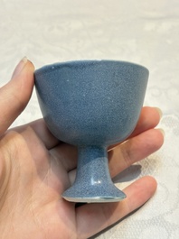 A pair of Chinese blue-glazed 'Hatcher Cargo' vases with incised dragons and a stem cup, Transitional period