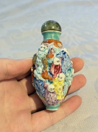 Four Chinese famille rose moulded 'Luohan' snuff bottles, Qianlong marks, 19th C.