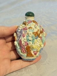 Four Chinese famille rose moulded 'Luohan' snuff bottles, Qianlong marks, 19th C.