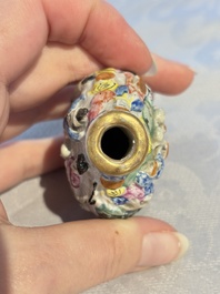 Four Chinese famille rose moulded 'Luohan' snuff bottles, Qianlong marks, 19th C.