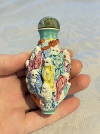 Four Chinese famille rose moulded 'Luohan' snuff bottles, Qianlong marks, 19th C.