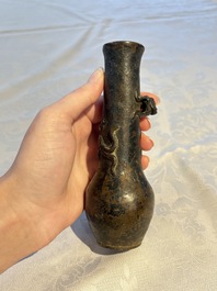 A small Chinese bronze vase with a chilong on a wooden stand, Yuan