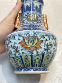 A pair of Chinese doucai 'Hu' vases with lotus scroll design, Qianlong mark, 19th C.