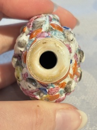 Four Chinese famille rose moulded 'Luohan' snuff bottles, Qianlong marks, 19th C.