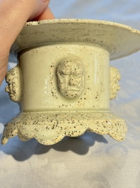 A Chinese qingbai censer with masks in relief, 20th C