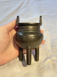 A Chinese silver-inlaid bronze tripod censer with clouds design, 19th C.