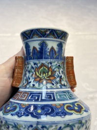 A pair of Chinese doucai 'Hu' vases with lotus scroll design, Qianlong mark, 19th C.