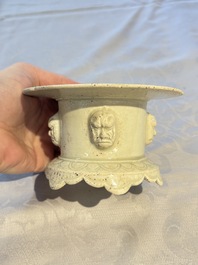 A Chinese qingbai censer with masks in relief, 20th C