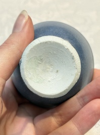 A pair of Chinese blue-glazed 'Hatcher Cargo' vases with incised dragons and a stem cup, Transitional period