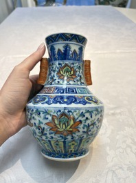 A pair of Chinese doucai 'Hu' vases with lotus scroll design, Qianlong mark, 19th C.