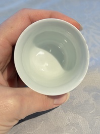 A Chinese iron-red decorated blue and white 'Dragon' saucer and a cup, Yongzheng and Tongzhi mark, 19/20th C.