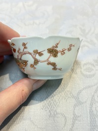 Three fine Chinese eggshell iron-red and gilt-decorated 'Boy and Goats' cups and saucers, Yongzheng