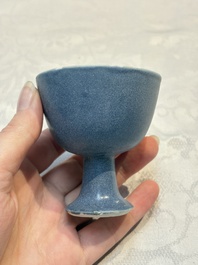 A pair of Chinese blue-glazed 'Hatcher Cargo' vases with incised dragons and a stem cup, Transitional period