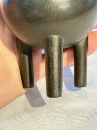 A Chinese silver-inlaid bronze tripod censer with clouds design, 19th C.