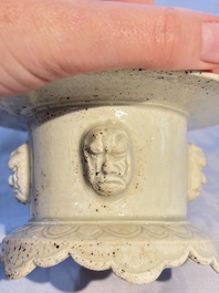 A Chinese qingbai censer with masks in relief, 20th C