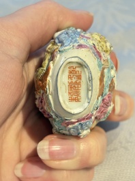 Four Chinese famille rose moulded 'Luohan' snuff bottles, Qianlong marks, 19th C.