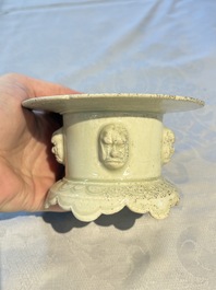 A Chinese qingbai censer with masks in relief, 20th C