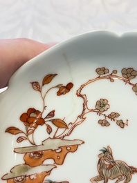 Three fine Chinese eggshell iron-red and gilt-decorated 'Boy and Goats' cups and saucers, Yongzheng