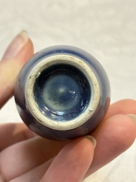 A pair of Chinese blue-glazed 'Hatcher Cargo' vases with incised dragons and a stem cup, Transitional period