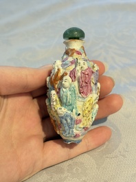 Four Chinese famille rose moulded 'Luohan' snuff bottles, Qianlong marks, 19th C.