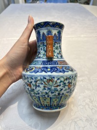 A pair of Chinese doucai 'Hu' vases with lotus scroll design, Qianlong mark, 19th C.