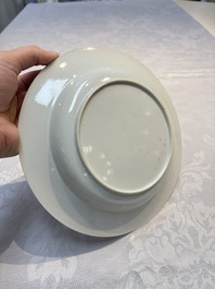 A fine Chinese grisaille, iron-red and gilt-decorated 'Riders on Horseback' plate, Yongzheng