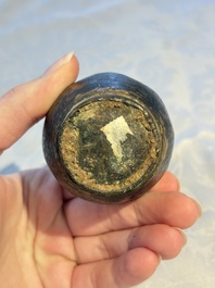 A small Chinese bronze vase with a chilong on a wooden stand, Yuan